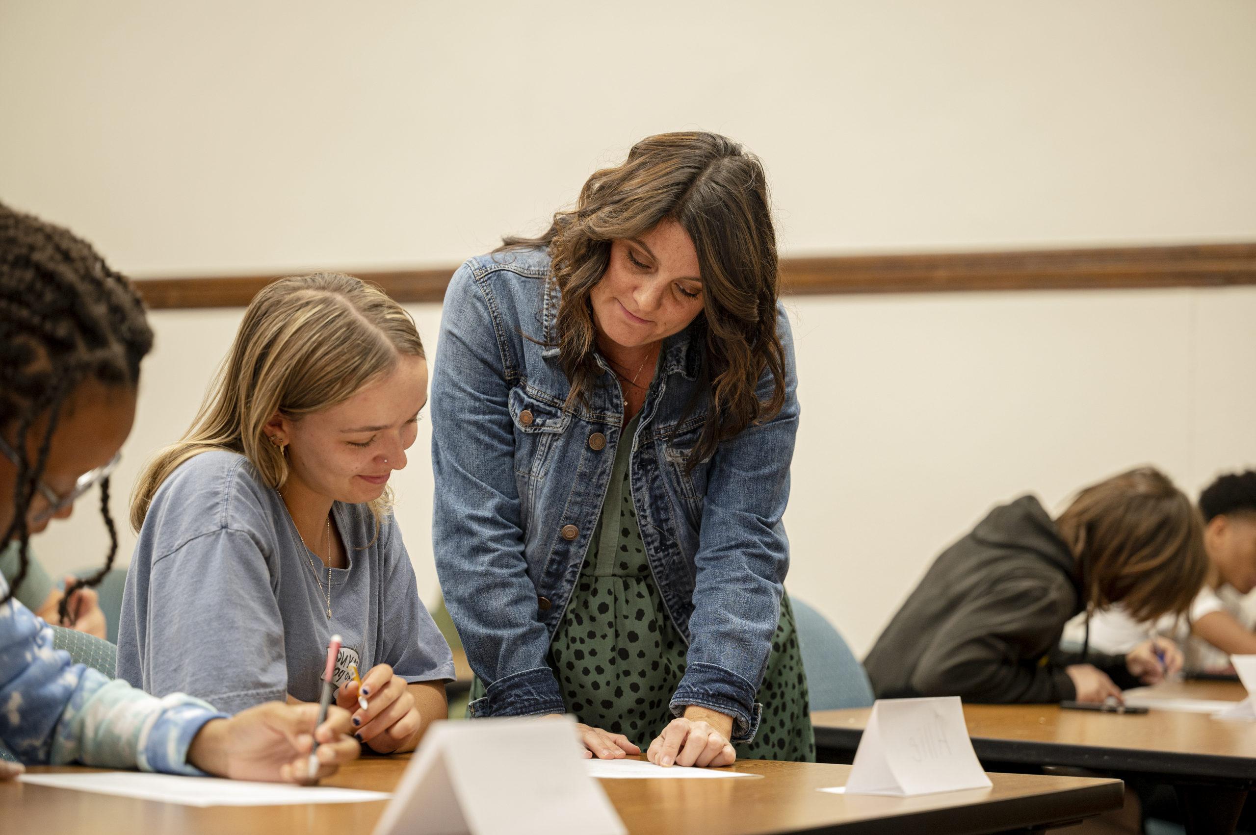 Professor helping student with work